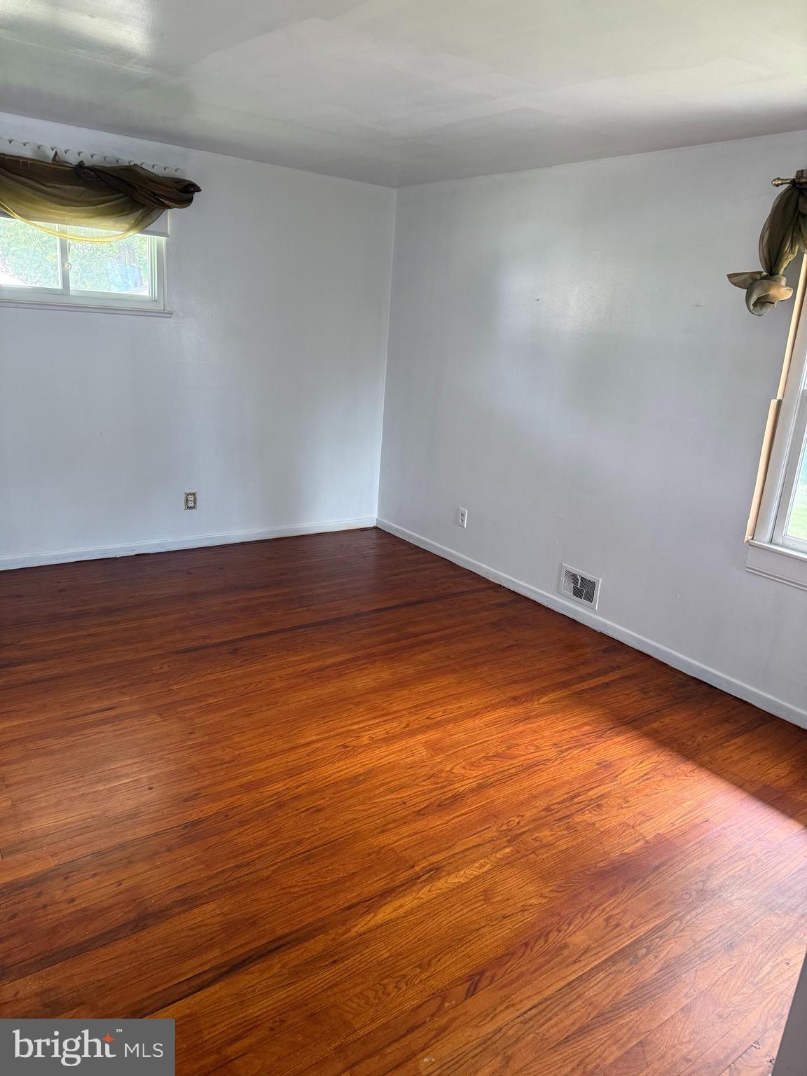 2 Larkin Road Burlington, NJ 08016 - Photo 14 of 24 an empty room with wooden floor and windows
