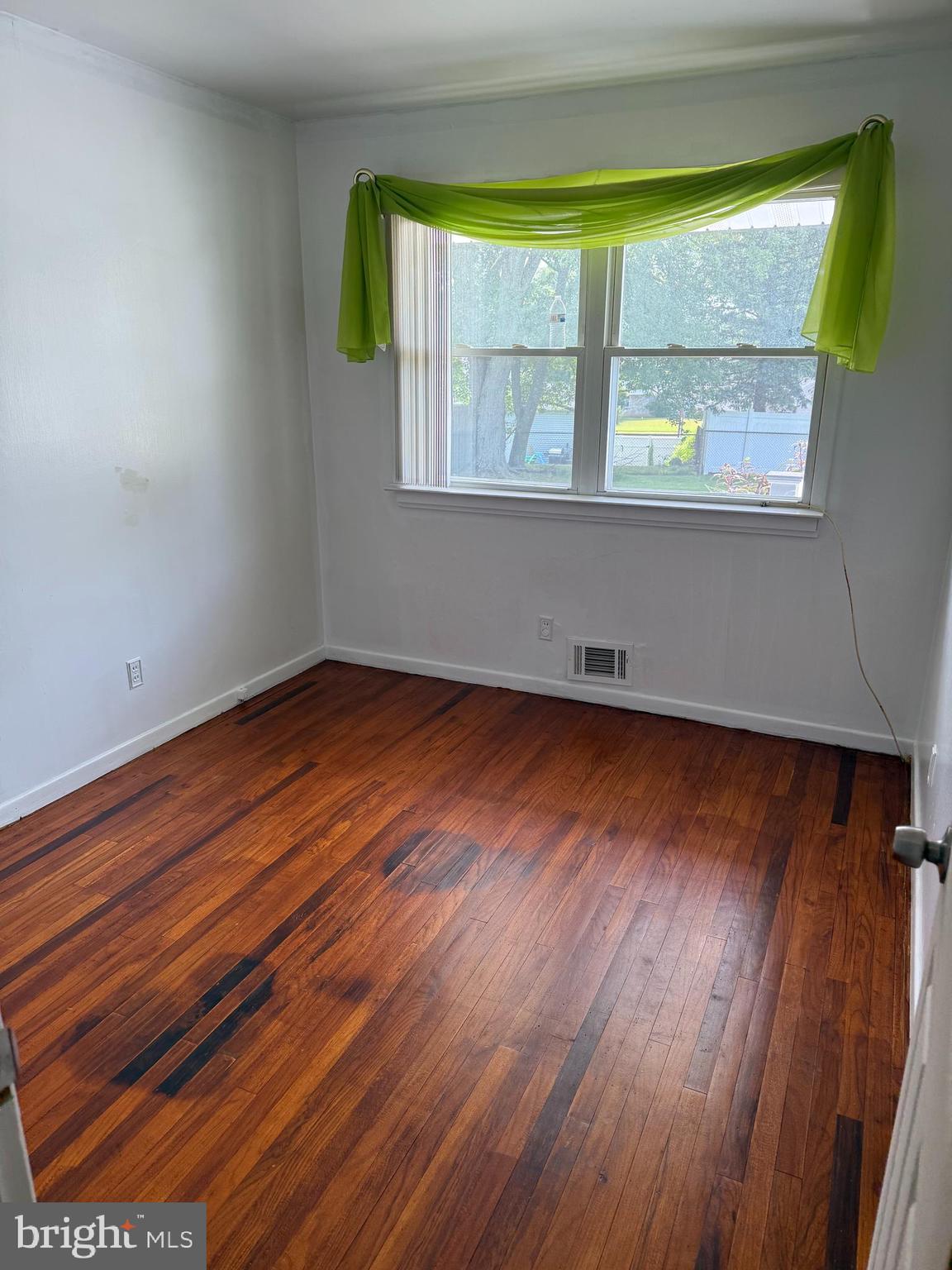 2 Larkin Road Burlington, NJ 08016 - Photo 15 of 24 a view of an empty room with wooden floor and a window