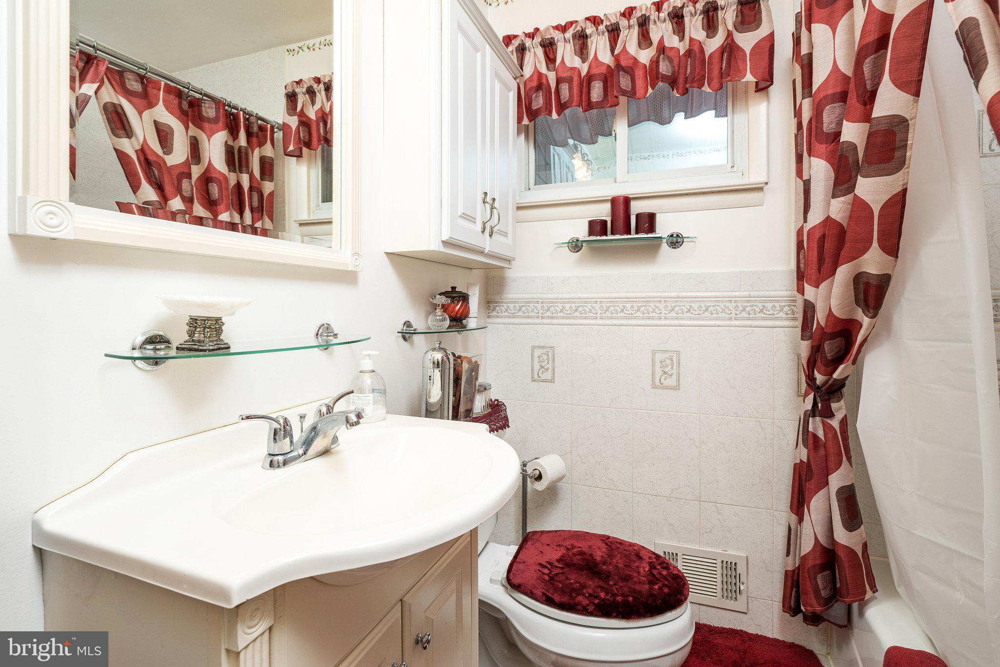 2 Larkin Road Burlington, NJ 08016 - Photo 17 of 24 a bathroom with a sink a toilet and a mirror
