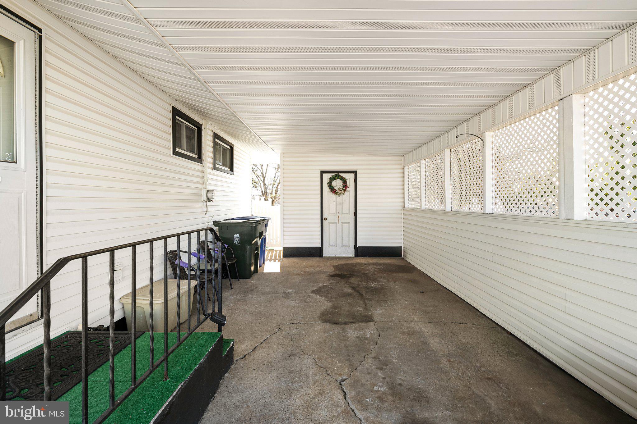 2 Larkin Road Burlington, NJ 08016 - Photo 3 of 24 a view of a porch with wooden floor and fence