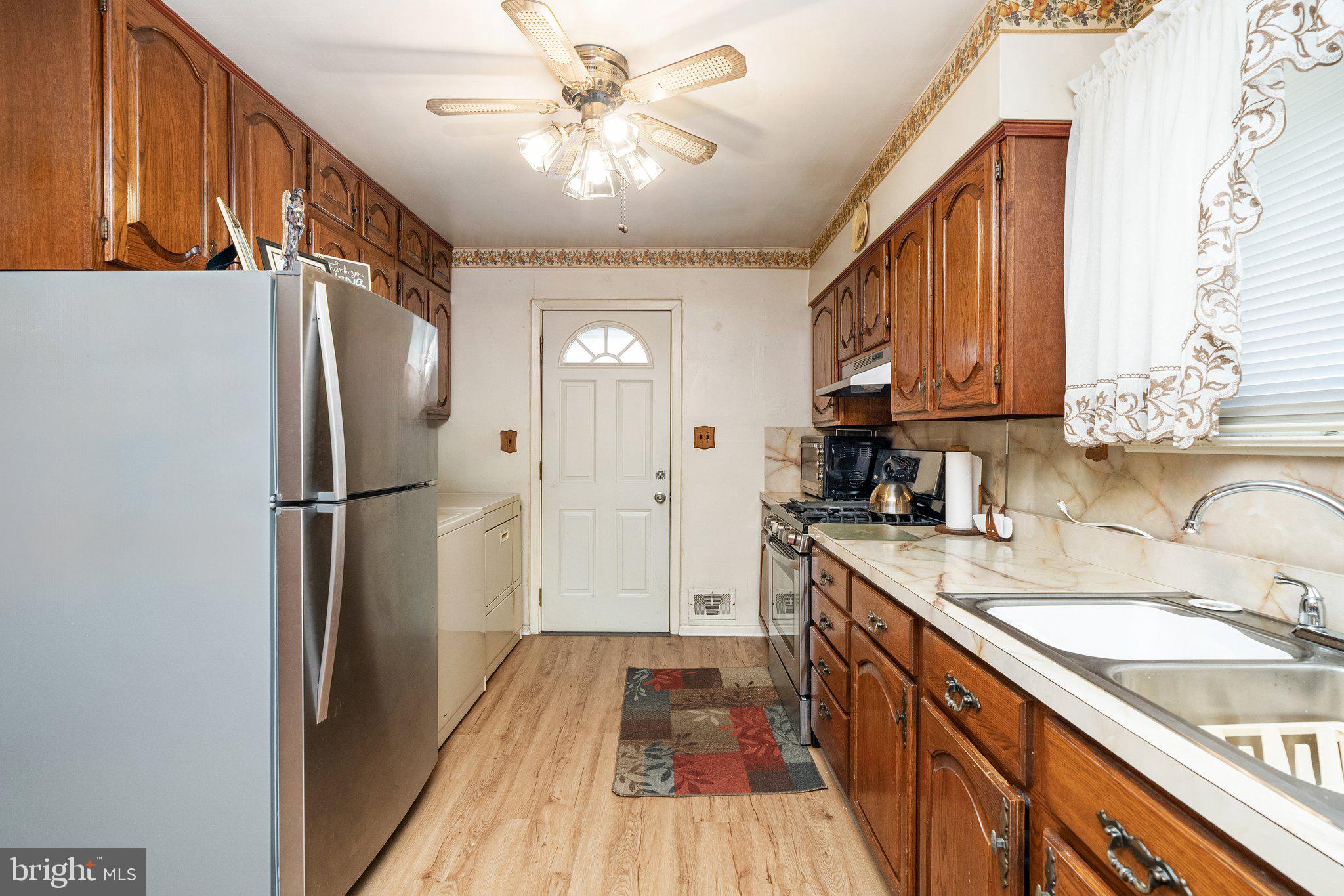 2 Larkin Road Burlington, NJ 08016 - Photo 8 of 24 a kitchen with kitchen island granite countertop a sink appliances cabinets and counter space