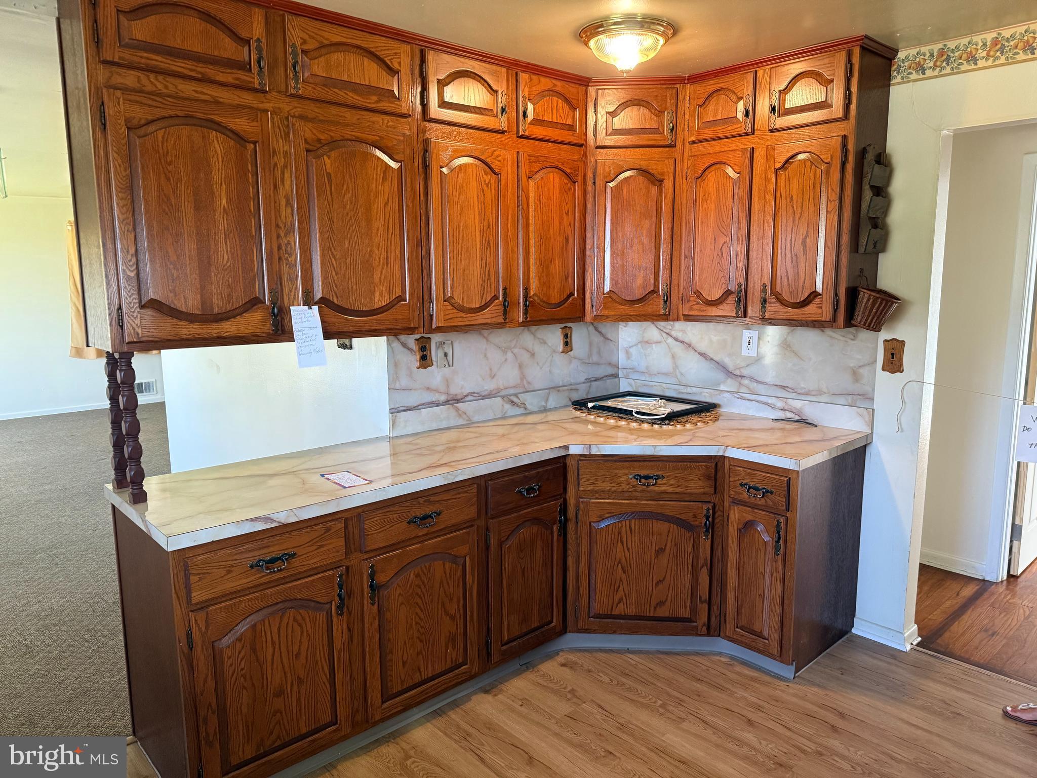 2 Larkin Road Burlington, NJ 08016 - Photo 9 of 24 a kitchen with stainless steel appliances granite countertop wooden cabinets a sink and dishwasher