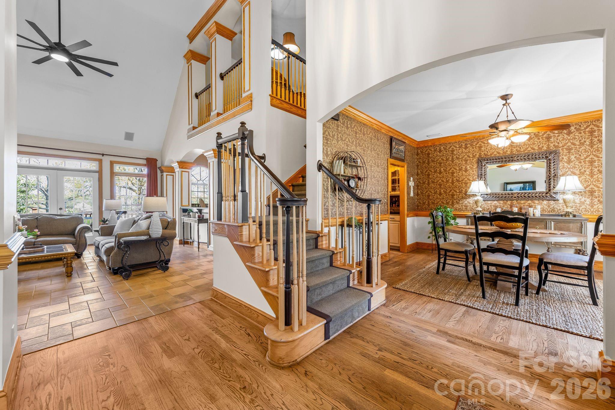 3530 Cardiff Lane Matthews, NC 28104 - Photo 5 of 39 a living room with lots of furniture and a chandelier