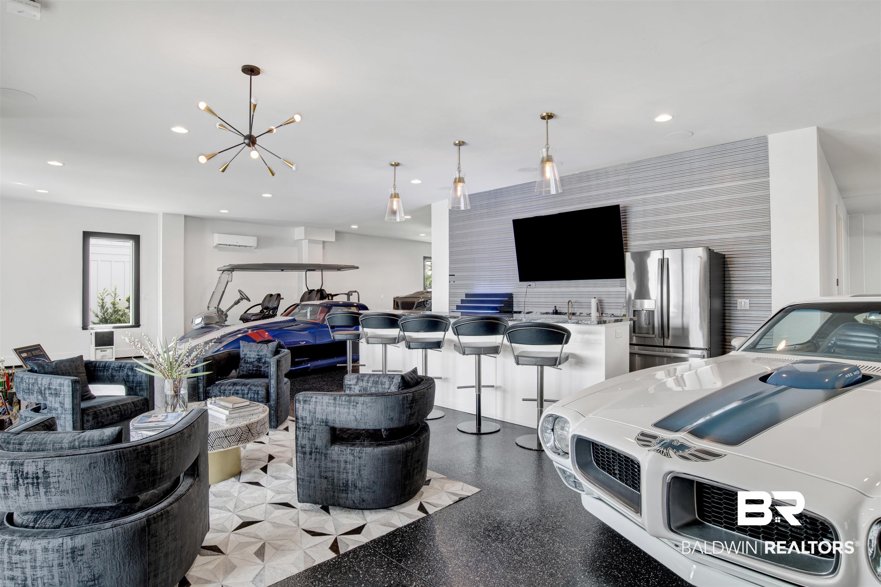 30239 Canal Court Orange Beach, AL 36561 - Photo 45 of 70 Garage featuring stainless steel fridge and recessed lighting