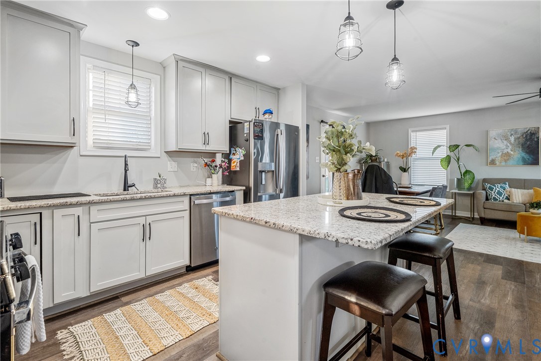 7401 Appelman Road Chesterfield, VA 23832 - Photo 17 of 17 a kitchen with stainless steel appliances granite countertop table chairs sink refrigerator and cabinets