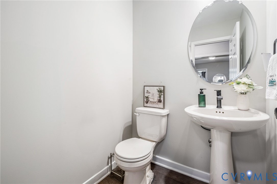 7401 Appelman Road Chesterfield, VA 23832 - Photo 7 of 17 a bathroom with a sink toilet and a mirror