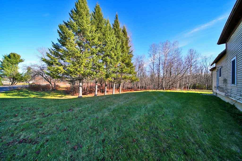 95 Boundary Line Road Bridgewater, ME 04735 - Photo 8 of 54 side-yard-northern-me-home