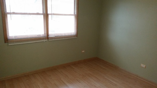 14514 Ridgeway Avenue Midlothian, IL 60445 - Photo 9 of 12 an empty room with a window