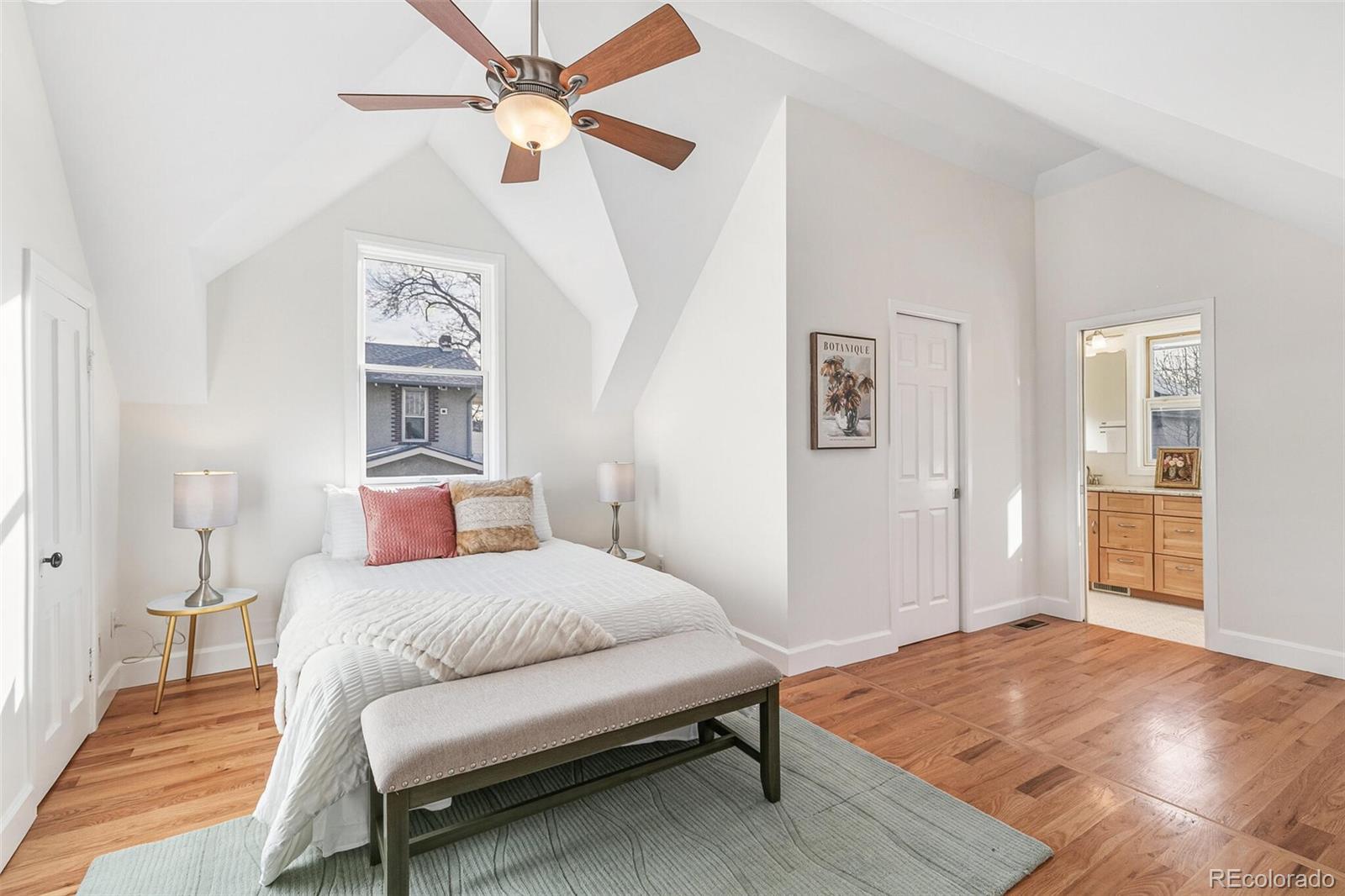 3885 Wolff Street Denver, CO 80212 - Photo 21 of 50 a bedroom with a bed and a table