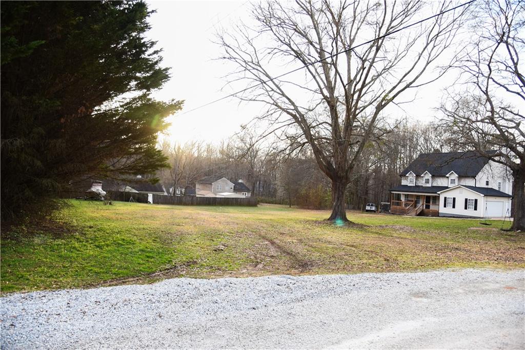 1264 GA Highway 211 Winder, GA 30680 - Photo 1 of 69 a view of a yard with a tree