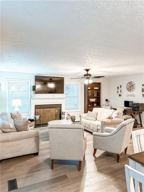 1264 GA Highway 211 Winder, GA 30680 - Photo 25 of 69 a living room with fireplace furniture and a flat screen tv