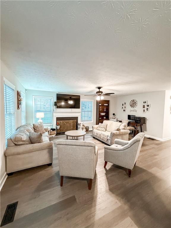 1264 GA Highway 211 Winder, GA 30680 - Photo 26 of 69 a living room with furniture and a fireplace