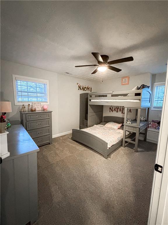 1264 GA Highway 211 Winder, GA 30680 - Photo 30 of 69 a living room with furniture and a ceiling fan