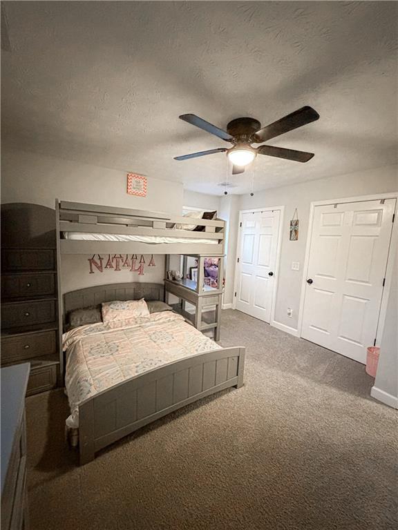 1264 GA Highway 211 Winder, GA 30680 - Photo 31 of 69 a bedroom with a bed and a chandelier
