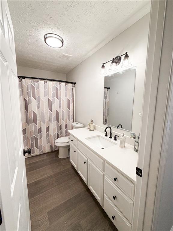1264 GA Highway 211 Winder, GA 30680 - Photo 33 of 69 a spacious bathroom with a double vanity sink toilet mirror and shower
