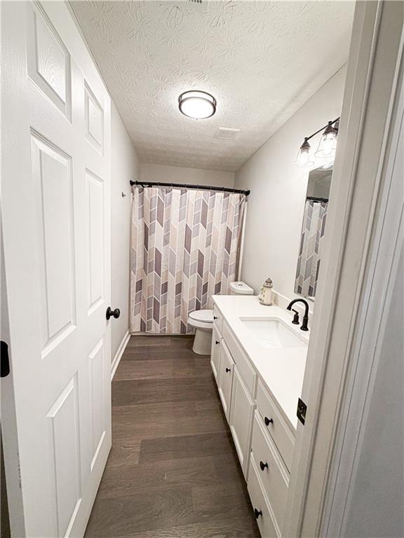 1264 GA Highway 211 Winder, GA 30680 - Photo 34 of 69 a bathroom with a sink a mirror and a bathtub