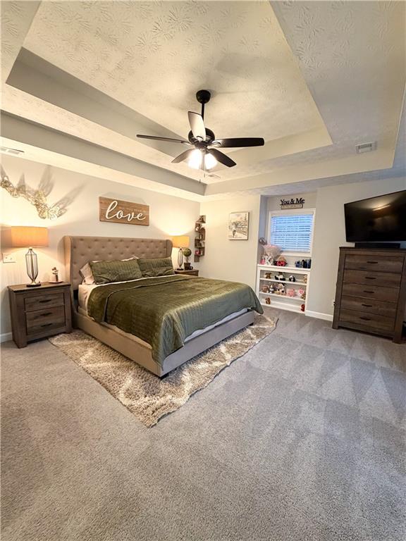 1264 GA Highway 211 Winder, GA 30680 - Photo 42 of 69 a spacious bedroom with a bed and ceiling fan