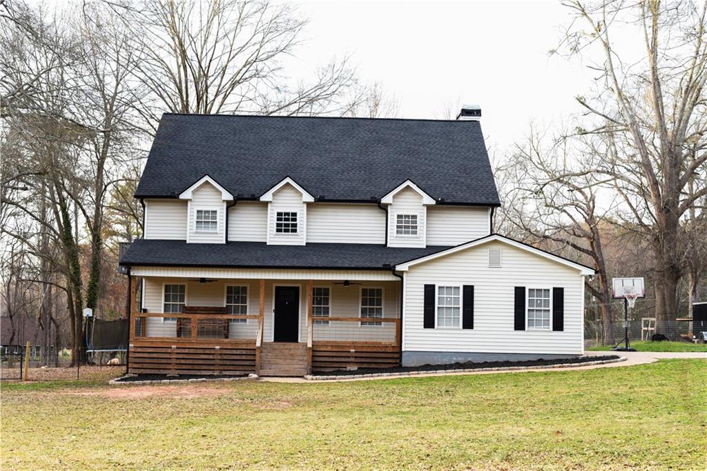 1264 GA Highway 211 Winder, GA 30680 - Photo 5 of 69 a front view of a house with a yard