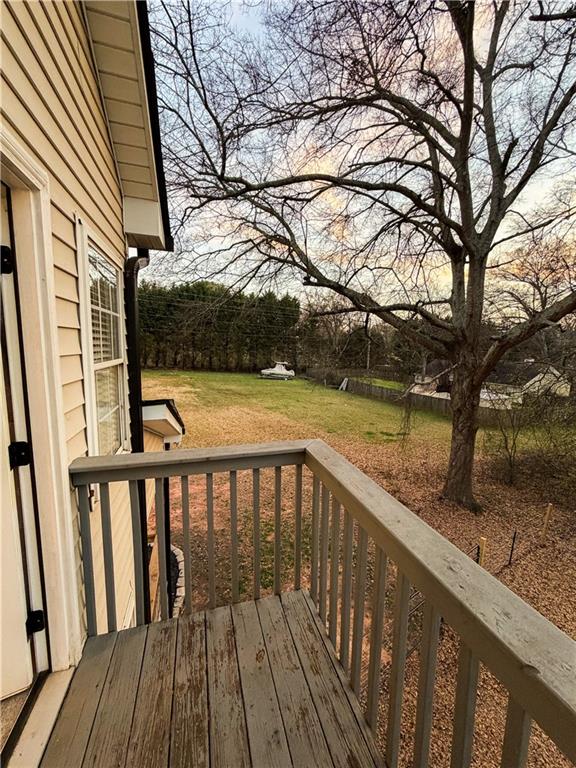 1264 GA Highway 211 Winder, GA 30680 - Photo 54 of 69 a view of balcony with wooden floor and fence