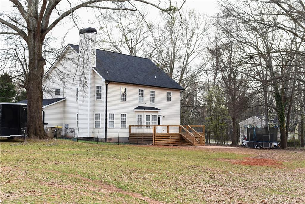 1264 GA Highway 211 Winder, GA 30680 - Photo 61 of 69 a view of a house with a yard