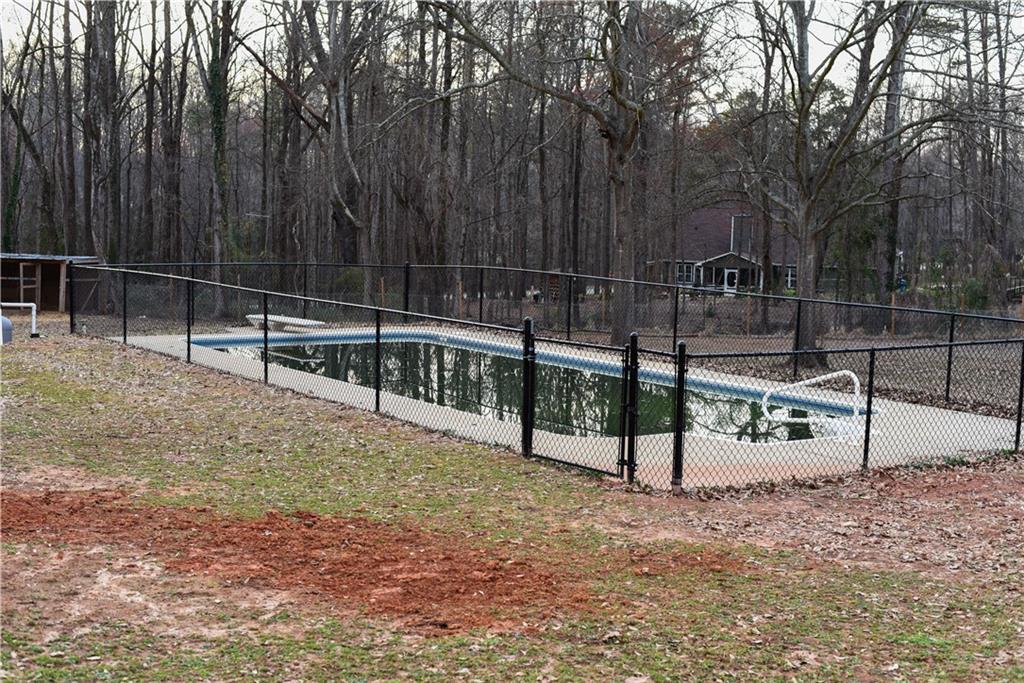 1264 GA Highway 211 Winder, GA 30680 - Photo 63 of 69 a view of outdoor space with wooden fence