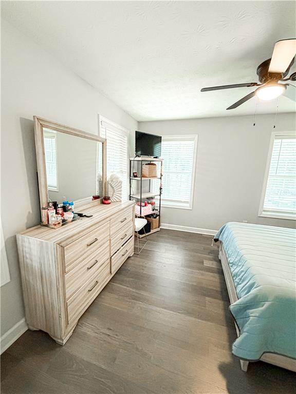 1264 GA Highway 211 Winder, GA 30680 - Photo 10 of 69 a room with a bed and a mirror on the dresser