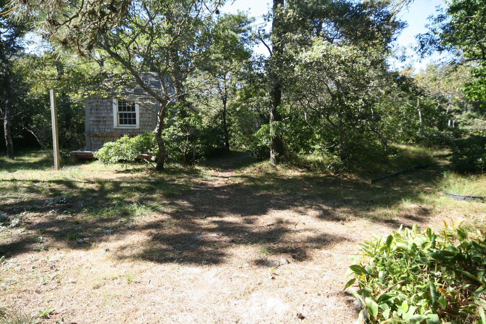 45 Fairgrounds Road Nantucket, MA 02554 - Photo 3 of 9 a backyard of a house with lots of green space