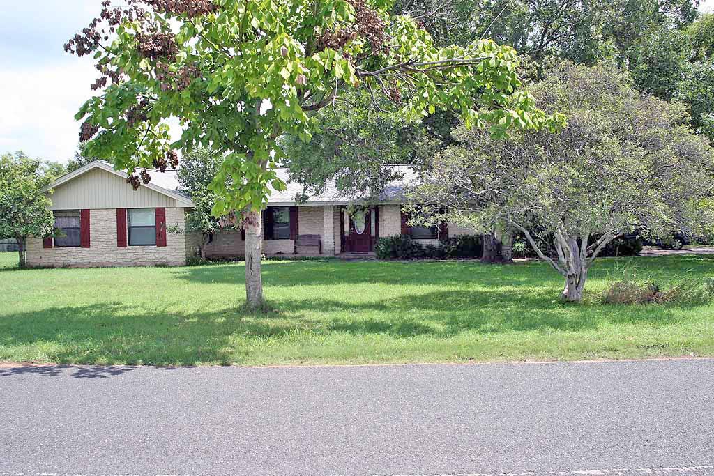 209 Southcross Road Georgetown, TX 78628 - Photo 1 of 1 a front view of house with yard and green space