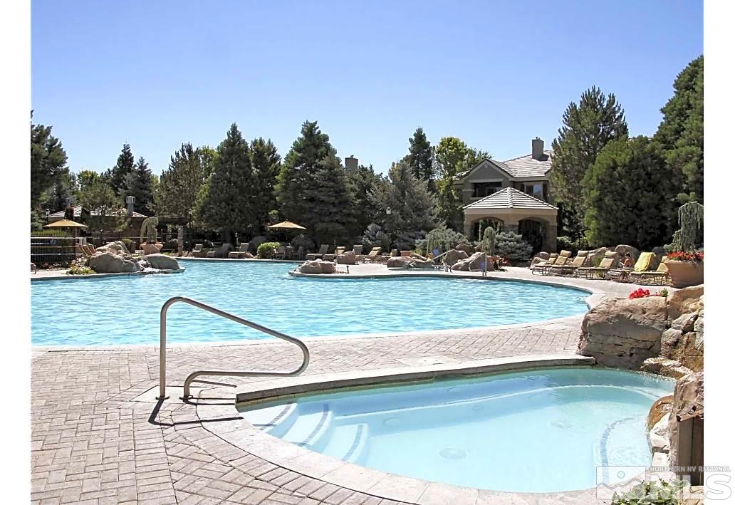 900 S, Unit 3822 Reno, NV 89521 - Photo 8 of 35 a view of swimming pool with a table and chairs