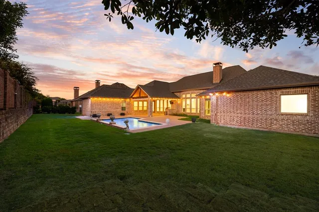 a view of a big house with a big yard