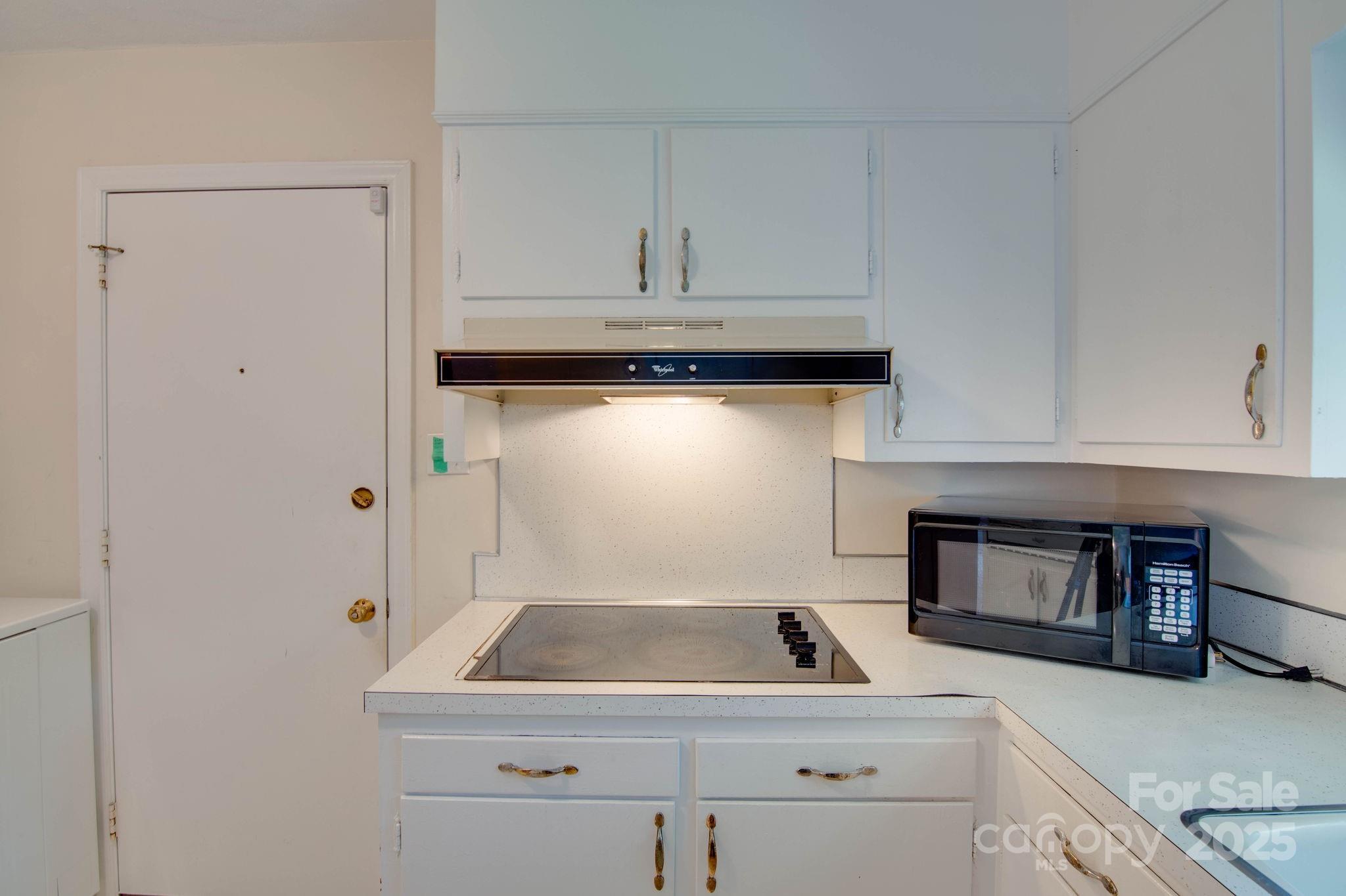 2319 Tin Mine Road Lincolnton, NC 28092 - Photo 13 of 30 a kitchen with a sink and cabinets