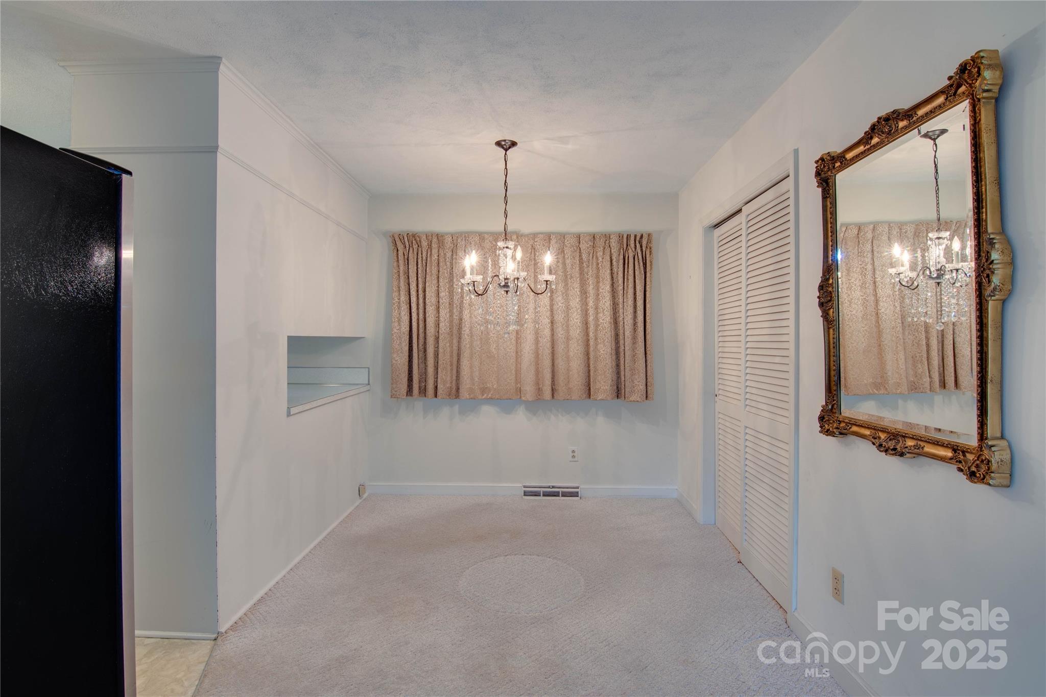 2319 Tin Mine Road Lincolnton, NC 28092 - Photo 15 of 30 a view of an empty room with chandelier and window