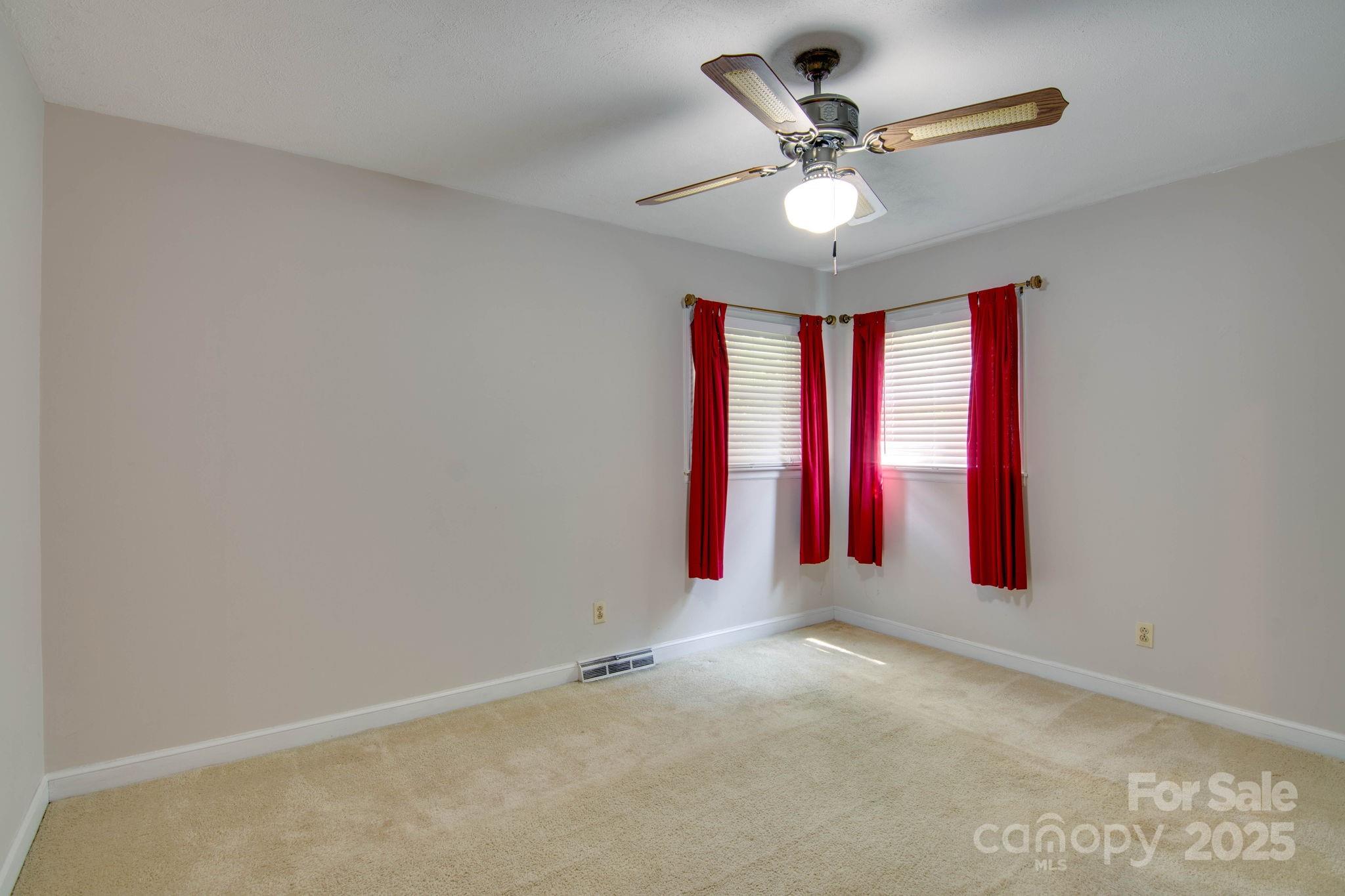 2319 Tin Mine Road Lincolnton, NC 28092 - Photo 19 of 30 an empty room with windows and fan