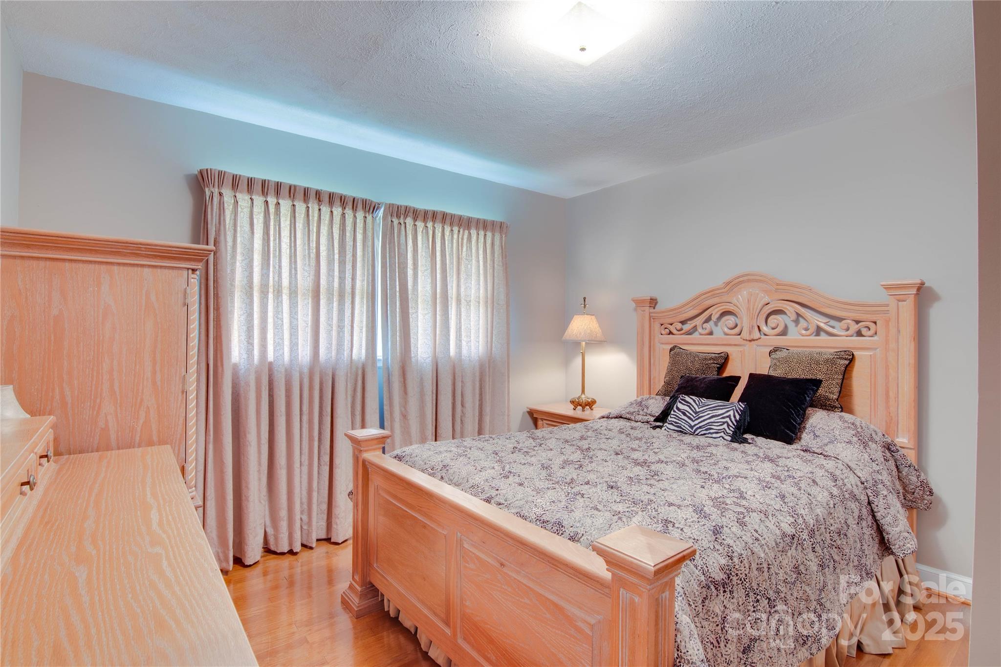 2319 Tin Mine Road Lincolnton, NC 28092 - Photo 24 of 30 a bedroom with a large bed and a dresser