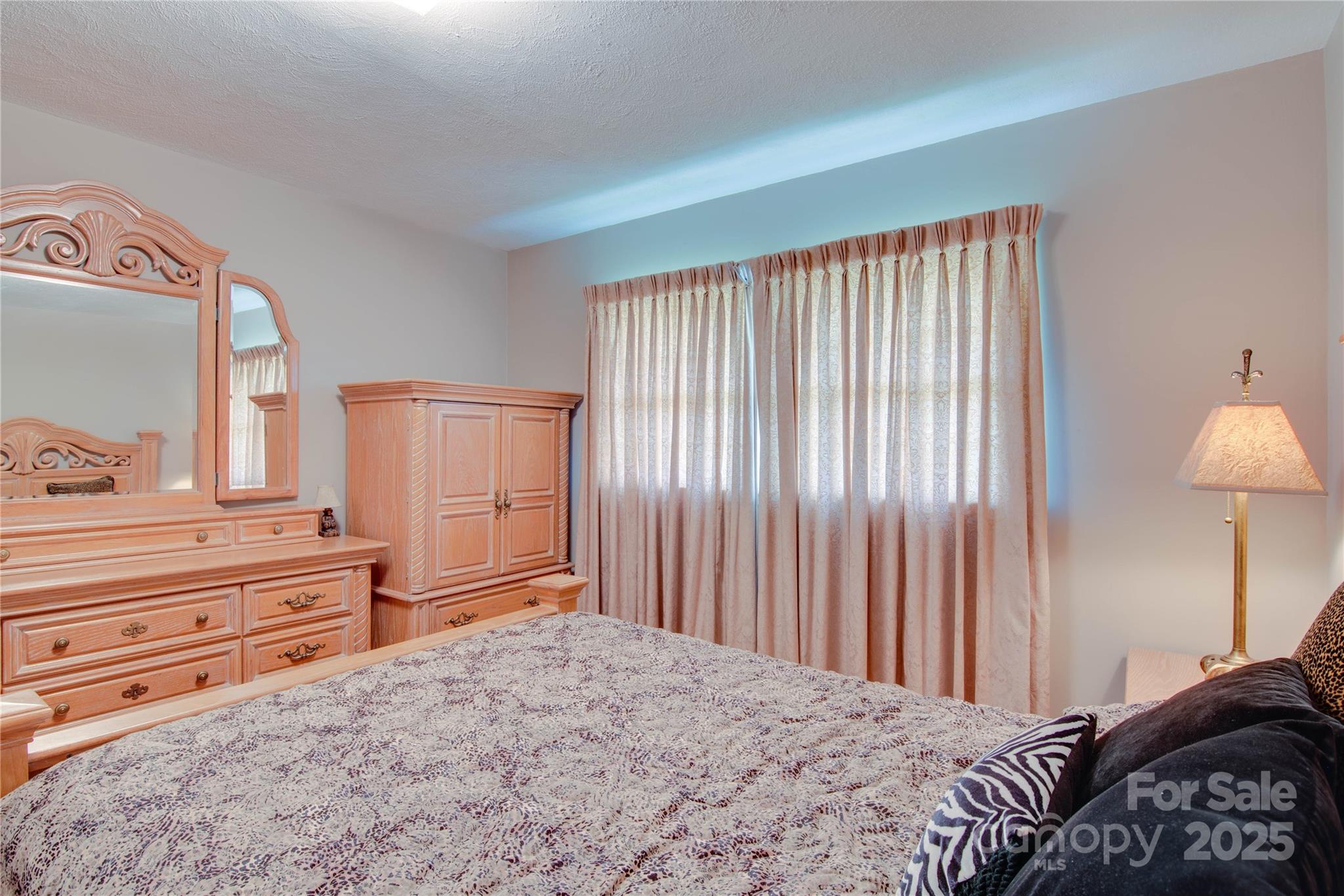 2319 Tin Mine Road Lincolnton, NC 28092 - Photo 25 of 30 a bedroom with a bed and a dresser in it