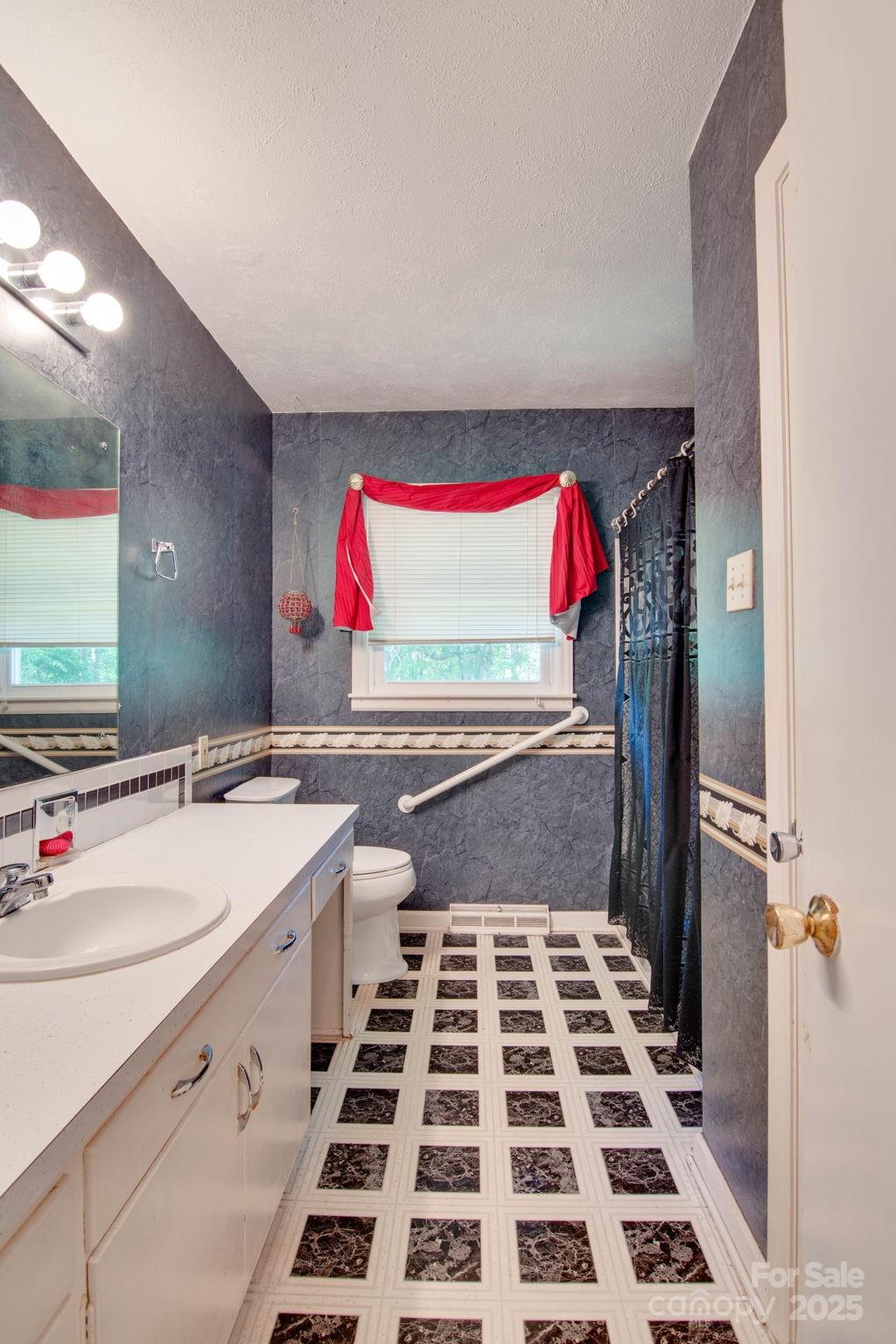 2319 Tin Mine Road Lincolnton, NC 28092 - Photo 26 of 30 a kitchen with a sink and a stove