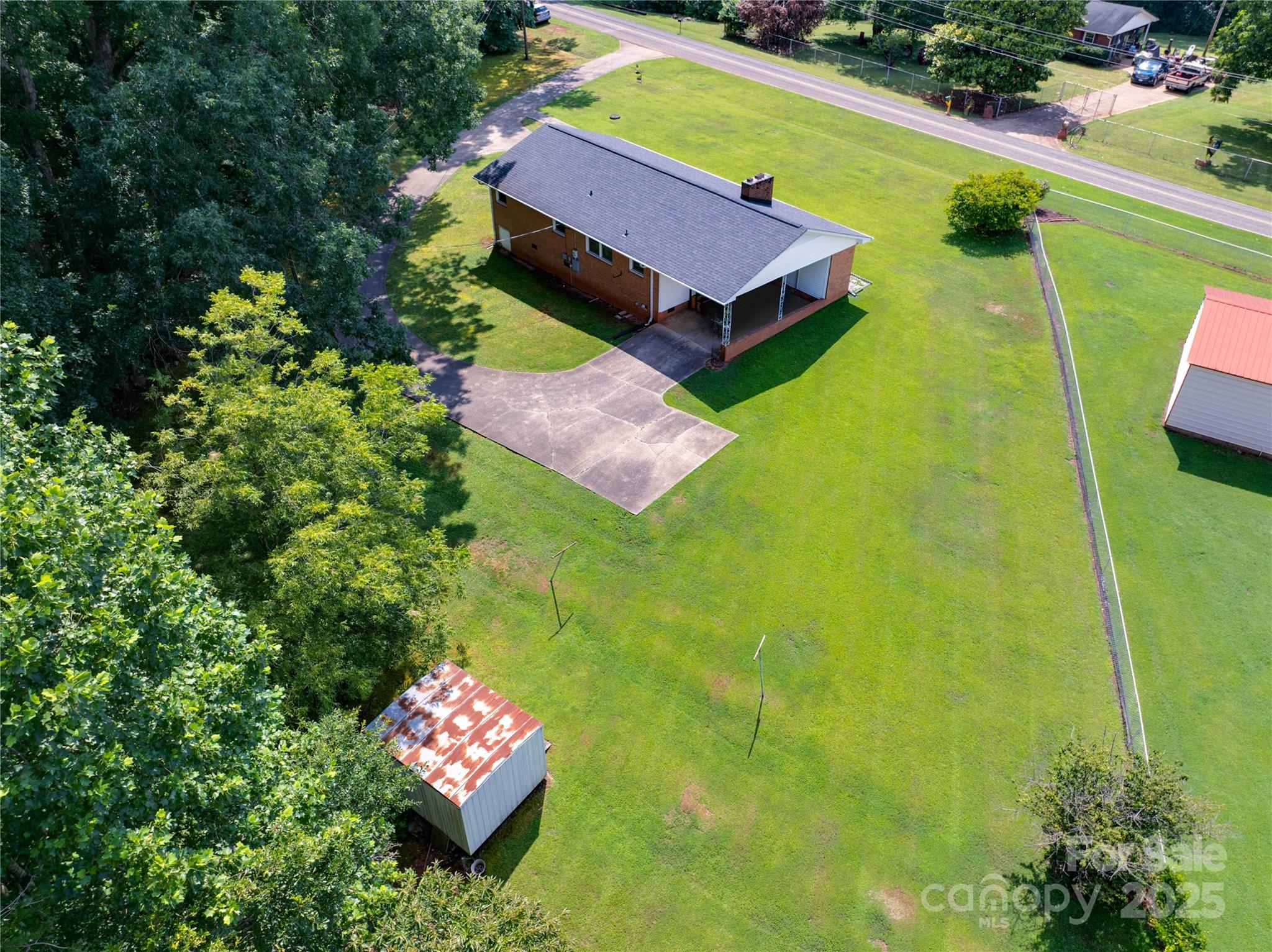 2319 Tin Mine Road Lincolnton, NC 28092 - Photo 29 of 30 a backyard of a house with yard and fountain in the back