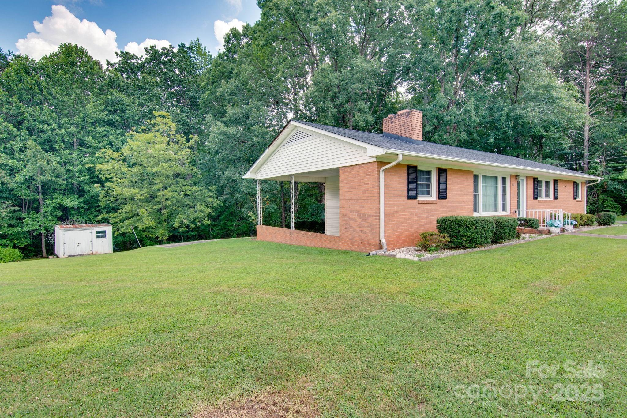2319 Tin Mine Road Lincolnton, NC 28092 - Photo 30 of 30 a front view of a house with garden