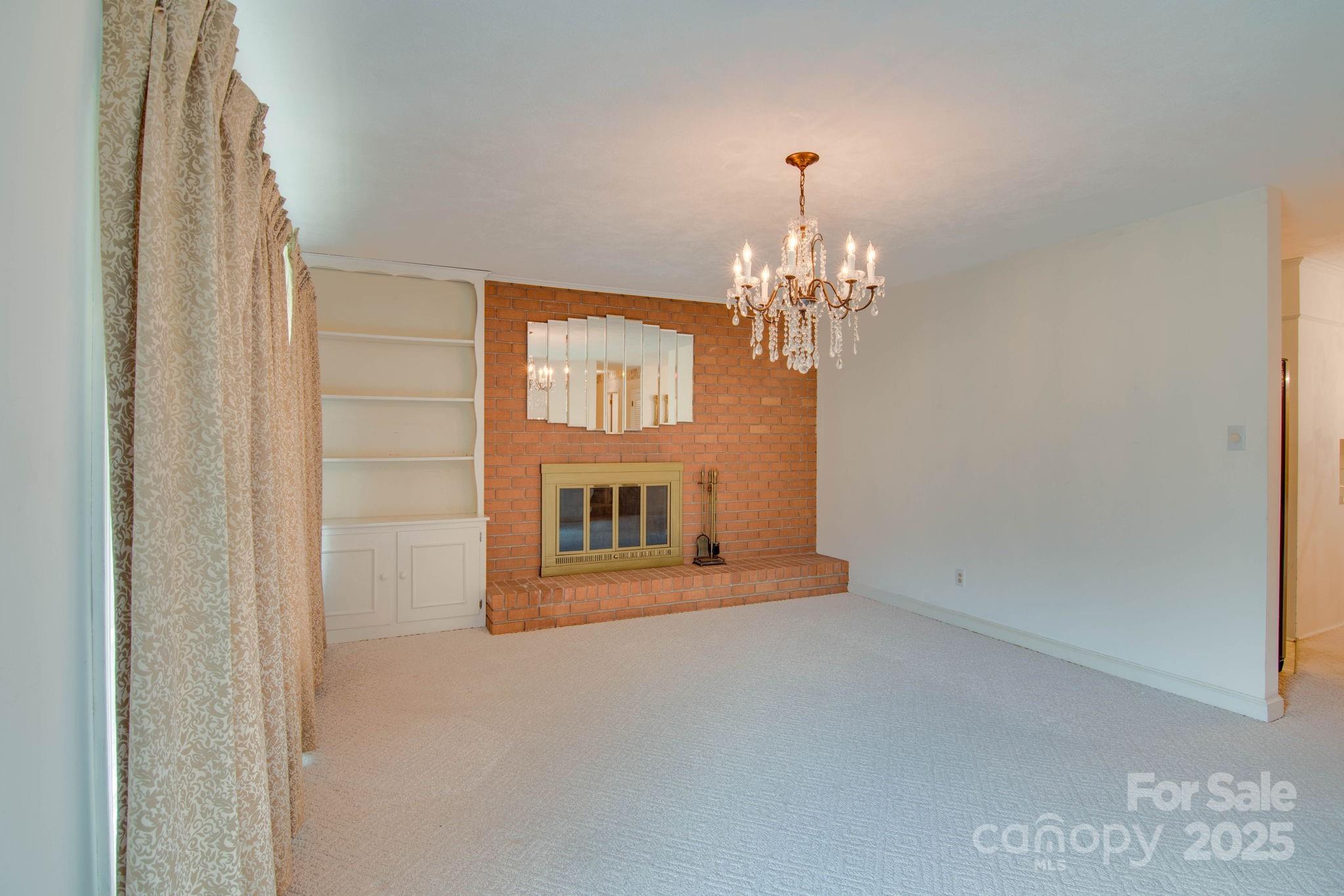2319 Tin Mine Road Lincolnton, NC 28092 - Photo 9 of 30 a view of a hallway with windows and chandelier