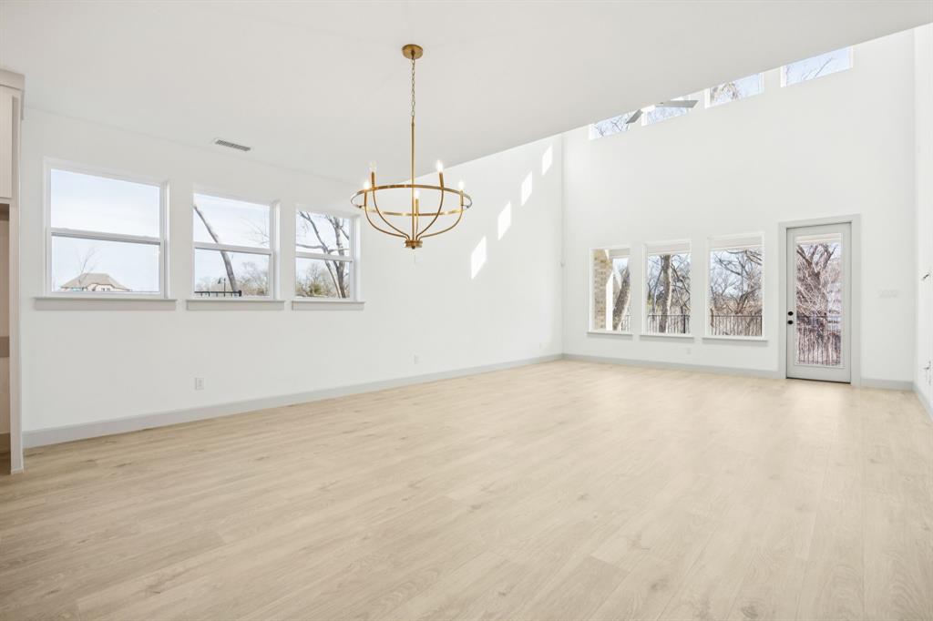 1400 Rose Mallow Road Celina, TX 75009 - Photo 7 of 21 Whether it's grand dinner parties or cozy family meals, this dining room fits all occasions!