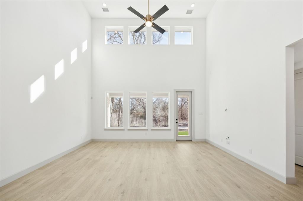 1400 Rose Mallow Road Celina, TX 75009 - Photo 8 of 21 Your new family room is flooded with natural light from a double stacked wall of windows!