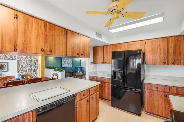 a living room with furniture and flowers