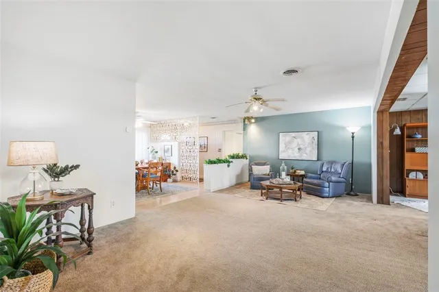 a living room with furniture a fireplace and a table