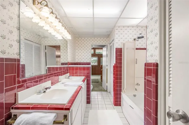 a bathroom with a sink a vanity and a mirror