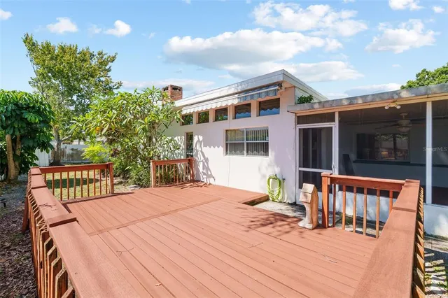 swimming pool view with a garden space