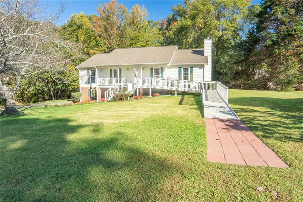 5904 Clairmont Way Powder Springs, GA 30127 - Photo 1 of 1 a front view of a house with yard patio and green space