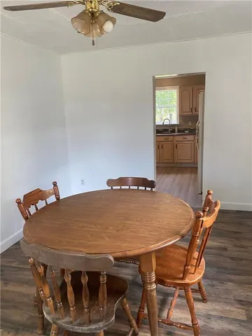 a dining room with a table and chairs