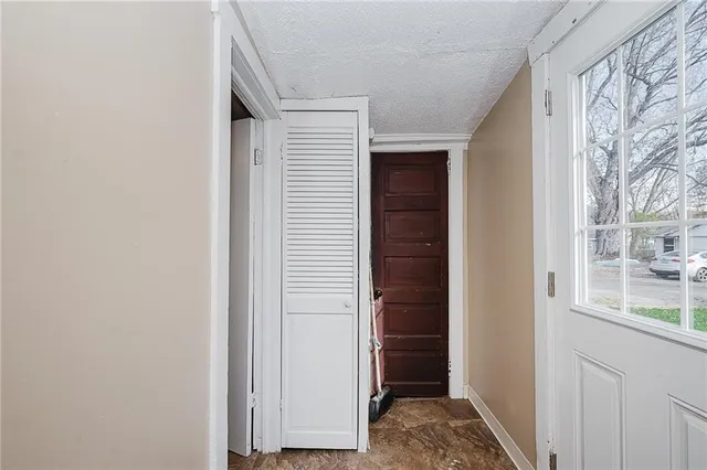 a view of bedroom with a window