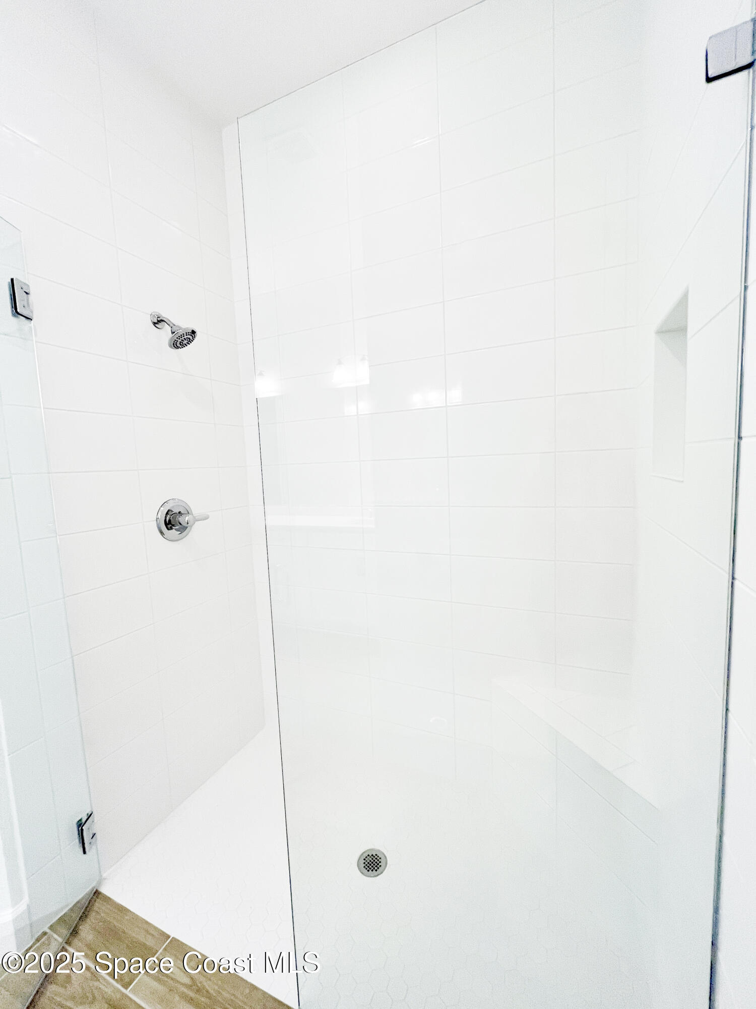 7707 Cache Crk Lane Melbourne, FL 32940 - Photo 13 of 18 a bathroom with a shower