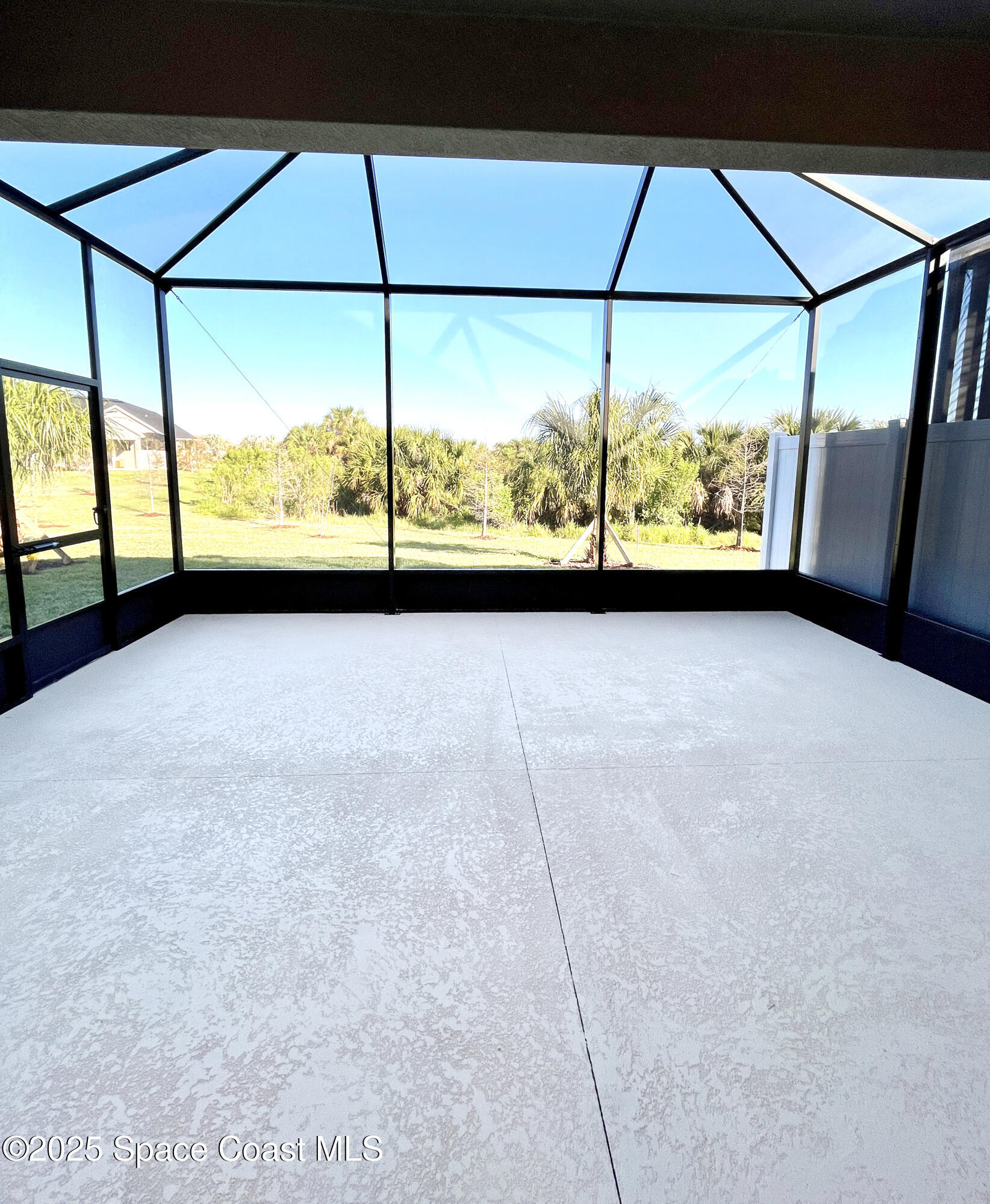 7707 Cache Crk Lane Melbourne, FL 32940 - Photo 16 of 18 a view of an empty room and window